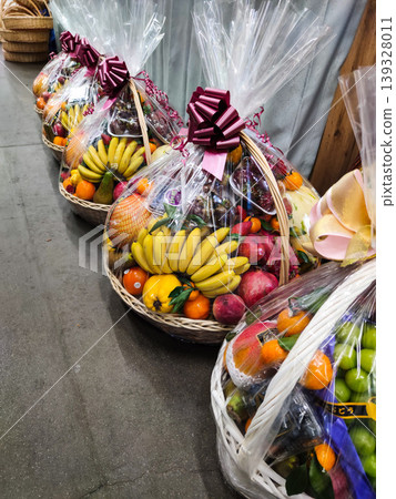 Festive fruit baskets are on sale at the market. Festive bouquets. 139328011