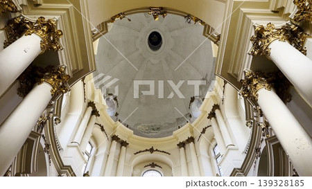 Interior view of a beautiful church showcasing ornate architecture, high ceilings and detailed decorations. Sacred space emphasizing the atmosphere of peace, spirituality and historical character Interior view of a beautiful church showcasing ornate architecture, high ceilings and detailed decorations. Sacred space emphasizing the atmosphere of peace, spirituality and historical character 139328185