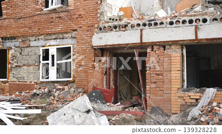 View to destroyed residential buildings at Kharkivska oblast. Ruined houses after bomb attacks on ukrainian territory from russia army. Consequences of russian invasion of Ukraine. Slow motion 139328228