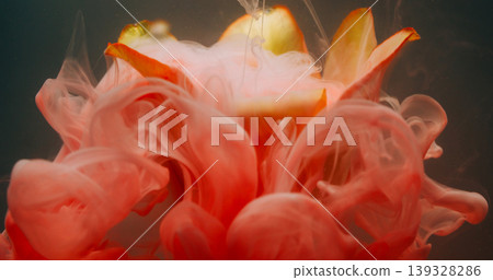 Flower abstraction. Splash paint. Blur yellow pink color tulip drop smog in water nature floating on floral art environmental dark black background. 139328286