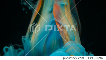 Flower steam. Ink drop. Blur blue color fume texture yellow red tropical tulip nature petals on abstract dark black background. Flower steam. Ink drop. Blur blue color fume texture yellow red tropical tulip nature petals on abstract dark black background. 139328287