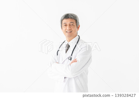 Medical man in a white coat with a stethoscope Medical man in a white coat with a stethoscope 139328427