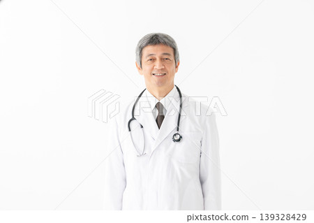 Medical man in a white coat with a stethoscope Medical man in a white coat with a stethoscope 139328429