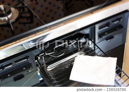 Cleaning a household gas stove 139328780
