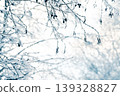 Tree branches in the snow. Winter landscape. 139328827