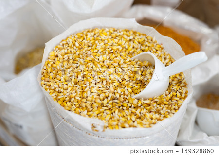 Corn kernels in sack at an market. Grains are ready for sale or export Corn kernels in sack at an market. Grains are ready for sale or export 139328860
