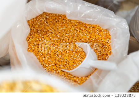 Large bag of dry corn for sale in grocery store 139328873
