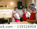 Senior Caucasian and Black Women Chefs Preparing Pastries in Commercial Kitchen Bakery 139328908