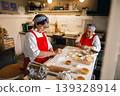 Senior Caucasian and Black Women Chefs Preparing Pastries in Commercial Kitchen Bakery 139328914