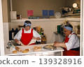 Senior Caucasian and Black women chefs preparing pastry dough in a professional kitchen bakery 139328916