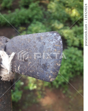 Close up of a weathered and pitted metal tip of an old Javanese bamboo splitting tool in Indonesia Close up of a weathered and pitted metal tip of an old Javanese bamboo splitting tool in Indonesia 139329024