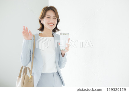 Business woman with tumbler Business woman with tumbler 139329159