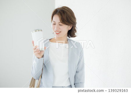 Business woman with tumbler Business woman with tumbler 139329163
