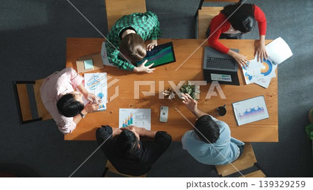 Time lapse of business people working together to analyze chart. Convocation. 139329259