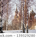 Spasskaya Tower of the Moscow Kremlin. View through bare tree branches. Winter landscape. 139329280