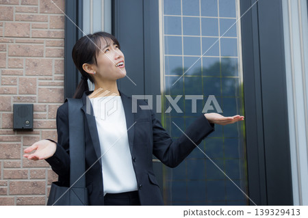 Business woman pointing an umbrella Business woman pointing an umbrella 139329413