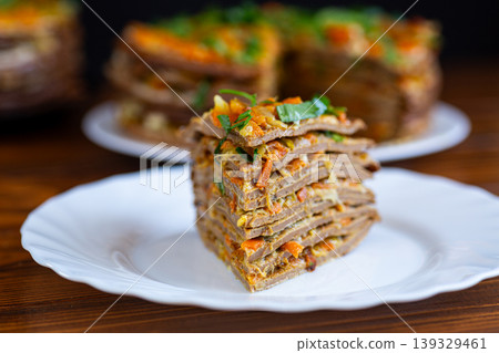 savory liver cake with vegetables and herbs on wooden table 139329461
