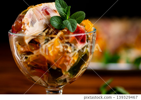 gourmet coffee fruit gelatin dessert with fresh mint garnish 139329467