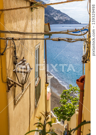 Narrow street view with sea and beach in Positano Italy Narrow street view with sea and beach in Positano Italy 139329498