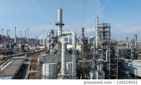 Oil storage tank with oil refinery plant background, Global business power and energy chemical barrel, Oil refinery factory oil storage tank, Petrochemical industrial with blue sky. Oil storage tank with oil refinery plant background, Global business power and energy chemical barrel, Oil refinery factory oil storage tank, Petrochemical industrial with blue sky. 139329581