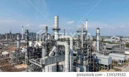Oil storage tank with oil refinery plant background, Global business power and energy chemical barrel, Oil refinery factory oil storage tank, Petrochemical industrial with blue sky. 139329582