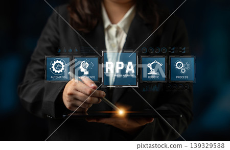 A business professional interacts with Robotic Process Automation on a tablet, showcasing the integration of technology within modern office settings and its impact on efficiency. Sigmoid 139329588