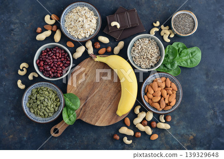 Top view of magnesium rich foods arranged on a dark background Top view of magnesium rich foods arranged on a dark background 139329648