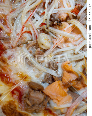 Seafood pizza close up with various toppings Seafood pizza close up with various toppings 139330057
