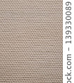 Beige textured paper background showing woven pattern 139330089