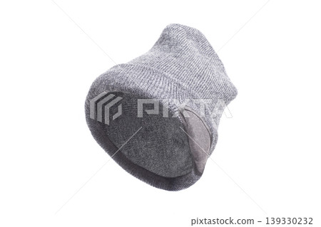 Grey winter beanie hat isolated on white background. Grey winter beanie hat isolated on white background. 139330232