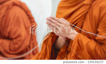 Buddhist Monk Hands in Prayer Position Holding Sacred Holy Thread During Blessing Ceremony Buddhist Monk Hands in Prayer Position Holding Sacred Holy Thread During Blessing Ceremony 139330237