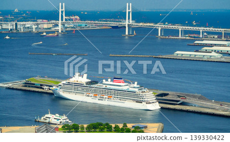 A luxury cruise ship and the Bay Bridge in Yokohama Port: A harbor scene on a sunny day. A luxury cruise ship and the Bay Bridge in Yokohama Port: A harbor scene on a sunny day. 139330422
