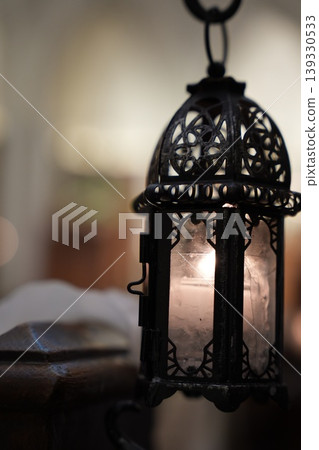 Antique lantern, the flickering light of a candle in the darkness 139330533