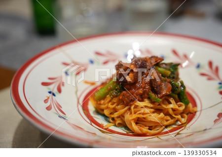 Pasta: Tagliatelle with meat sauce served on a decorative plate. Pasta: Tagliatelle with meat sauce served on a decorative plate. 139330534