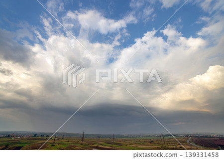 Blue sky covered with white puffy clouds. Blue sky covered with white puffy clouds. 139331458