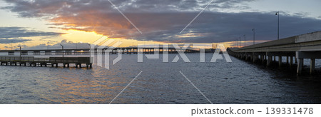 Barron Collier Bridge and Gilchrist Bridge in Florida with moving traffic. Transportation infrastructure in Charlotte County connecting Punta Gorda and Port Charlotte over Peace River 139331478