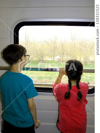 children on train station platform and traveling children on train station platform and traveling 139331525