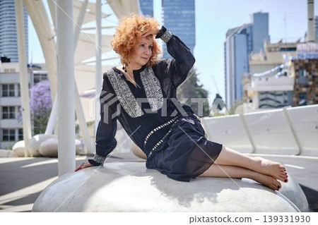 Fashion lifestyle portrait of red haired woman on urban bridge in sunlight Fashion lifestyle portrait of red haired woman on urban bridge in sunlight 139331930