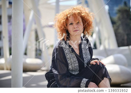 Portrait of red haired woman in soft sunlight outdoor lifestyle concept Portrait of red haired woman in soft sunlight outdoor lifestyle concept 139331932