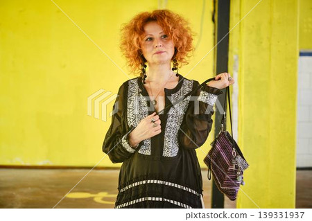 Red haired woman with stylish handbag lifestyle portrait Red haired woman with stylish handbag lifestyle portrait 139331937