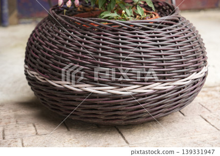 Large bulbous wicker floor planter with white accent weave band Large bulbous wicker floor planter with white accent weave band 139331947
