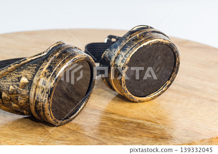 Steampunk skin glasses lie on a wooden background Steampunk skin glasses lie on a wooden background 139332045