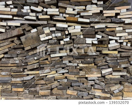 Stacked wooden planks and lumber scraps, rustic wood plank texture for construction, carpentry and woodworking Stacked wooden planks and lumber scraps, rustic wood plank texture for construction, carpentry and woodworking 139332070