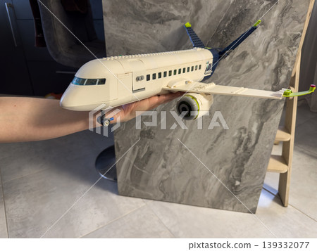 Airplane constructor, a plastic model of a passenger plane for children's games and creative construction 139332077