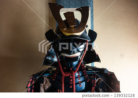 Traditional Japanese beauty: A dignified black lacquered suit of armor and helmet (with the five-seven paulownia family crest). Traditional Japanese beauty: A dignified black lacquered suit of armor and helmet (with the five-seven paulownia family crest). 139332128
