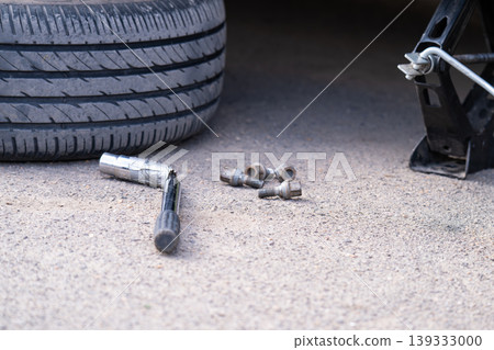 Mechanic Fixing Car Tire Mechanic Fixing Car Tire 139333000