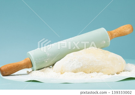 Flour, rolling pin, and pie dough. 139333002