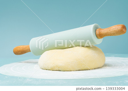 Flour, rolling pin, and pie dough. 139333004