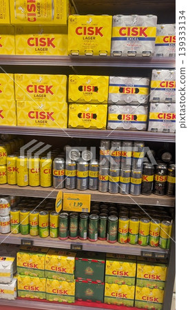 Different flavors of Maltese iconic beer Cisk cans on shelves 139333134