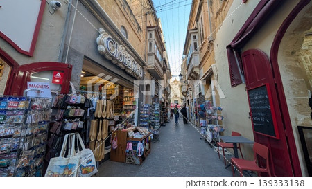 Narrow alley with souvenir shops in Gozo island 139333138